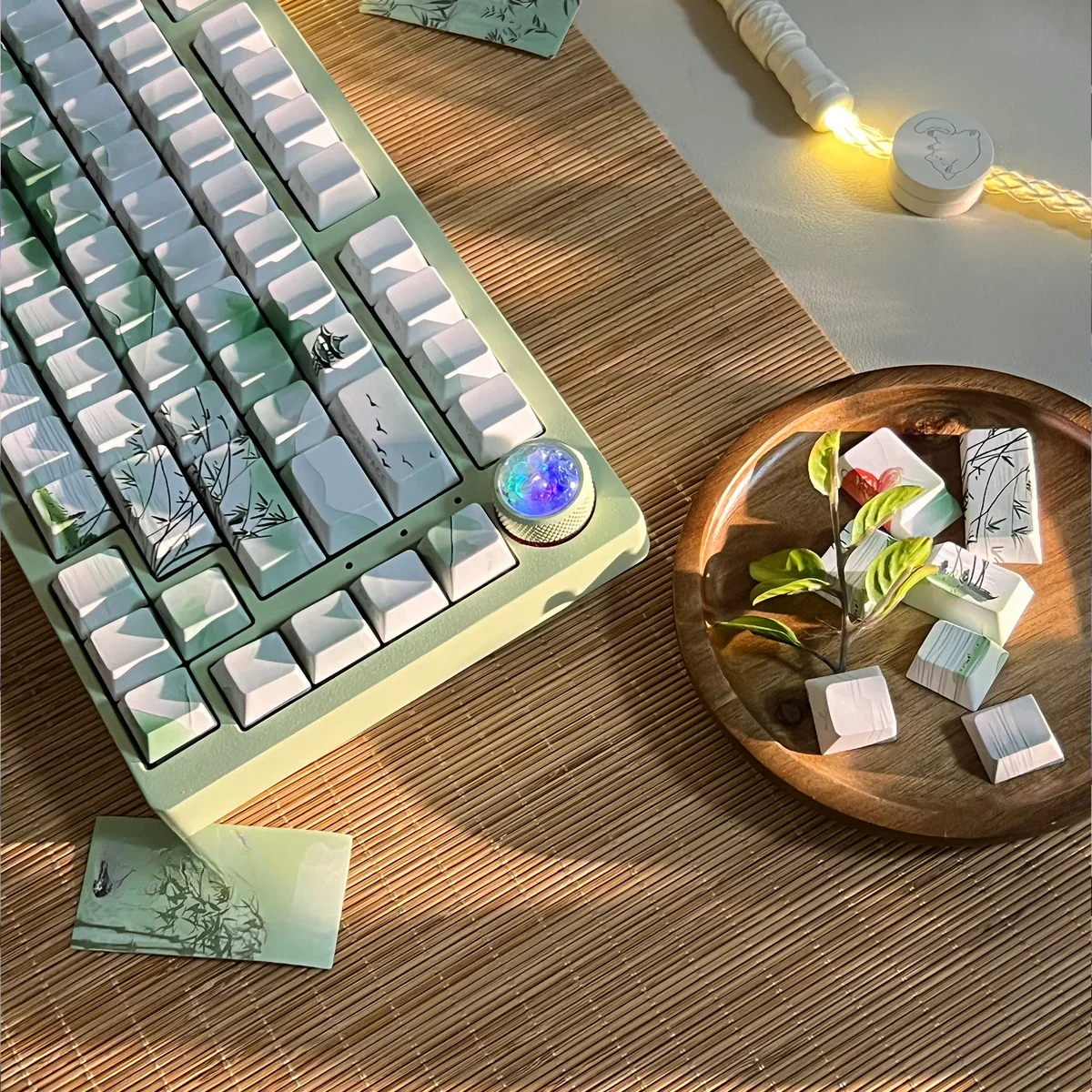 Poetic Chinese Landscape PBT keycaps set, shown from various angles, display serene ink wash art and traditional motifs. An artistic Chinese keycap set.