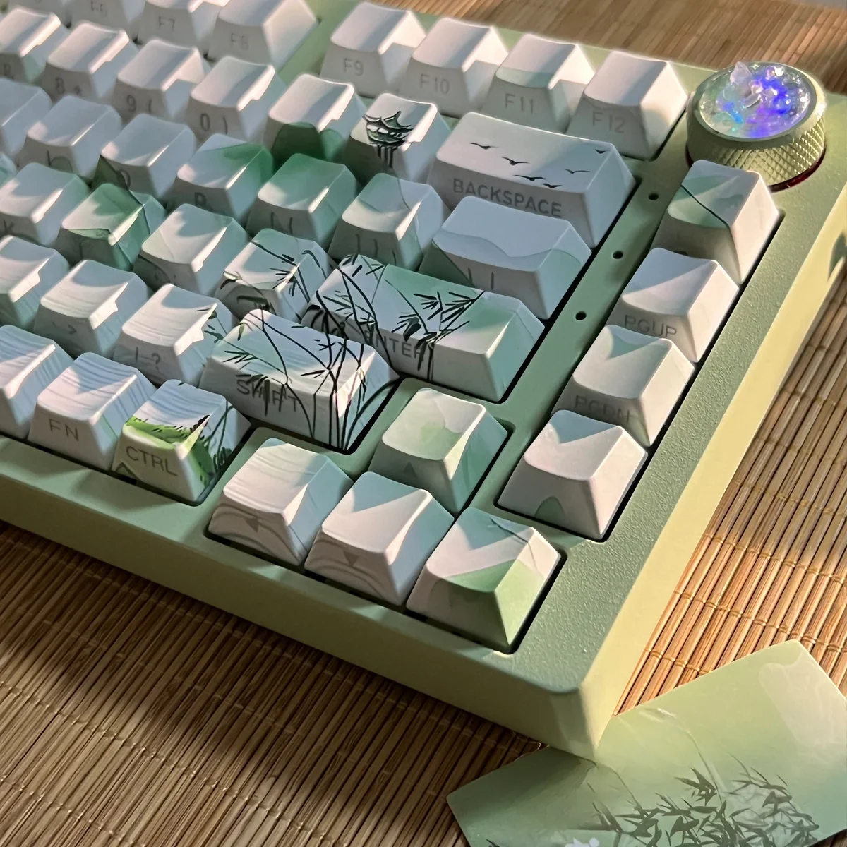 Poetic Chinese Landscape PBT Keycaps set displayed from various angles. Serene ink wash designs and traditional motifs define this artistic Chinese keycaps.