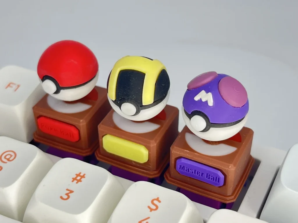 A vibrant 3D Pokemon Poke Ball keycap, featuring its iconic sculpted design. Relive childhood with this premium keyboard accessory.