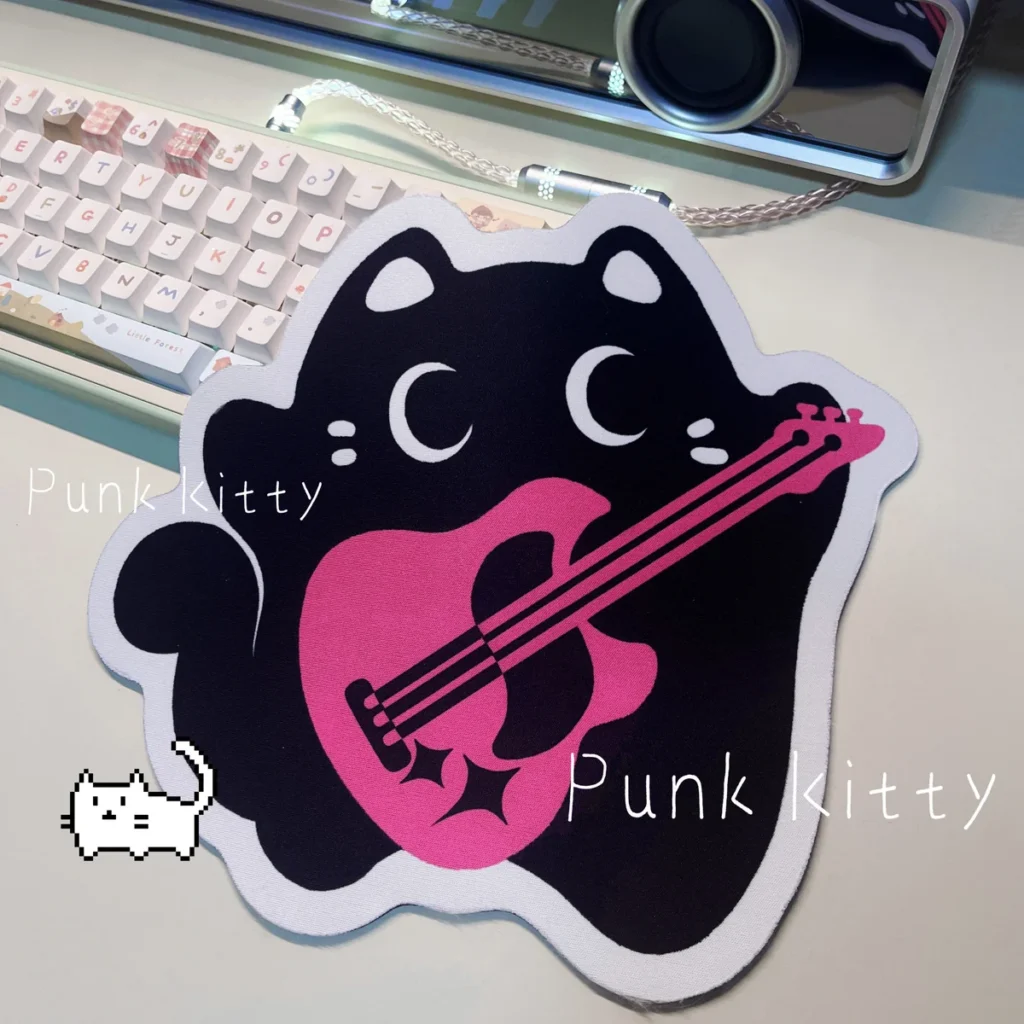 Playful black and pink Punk Kitty Mouse Pad with rebellious punk accents and an adorable, unique irregular shape for your desk.