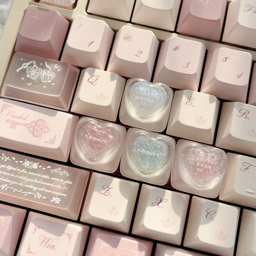 Handcrafted translucent resin heart keycap, a delicate main display showcasing romantic embedded hearts and angelic motifs for an artistic keyboard.