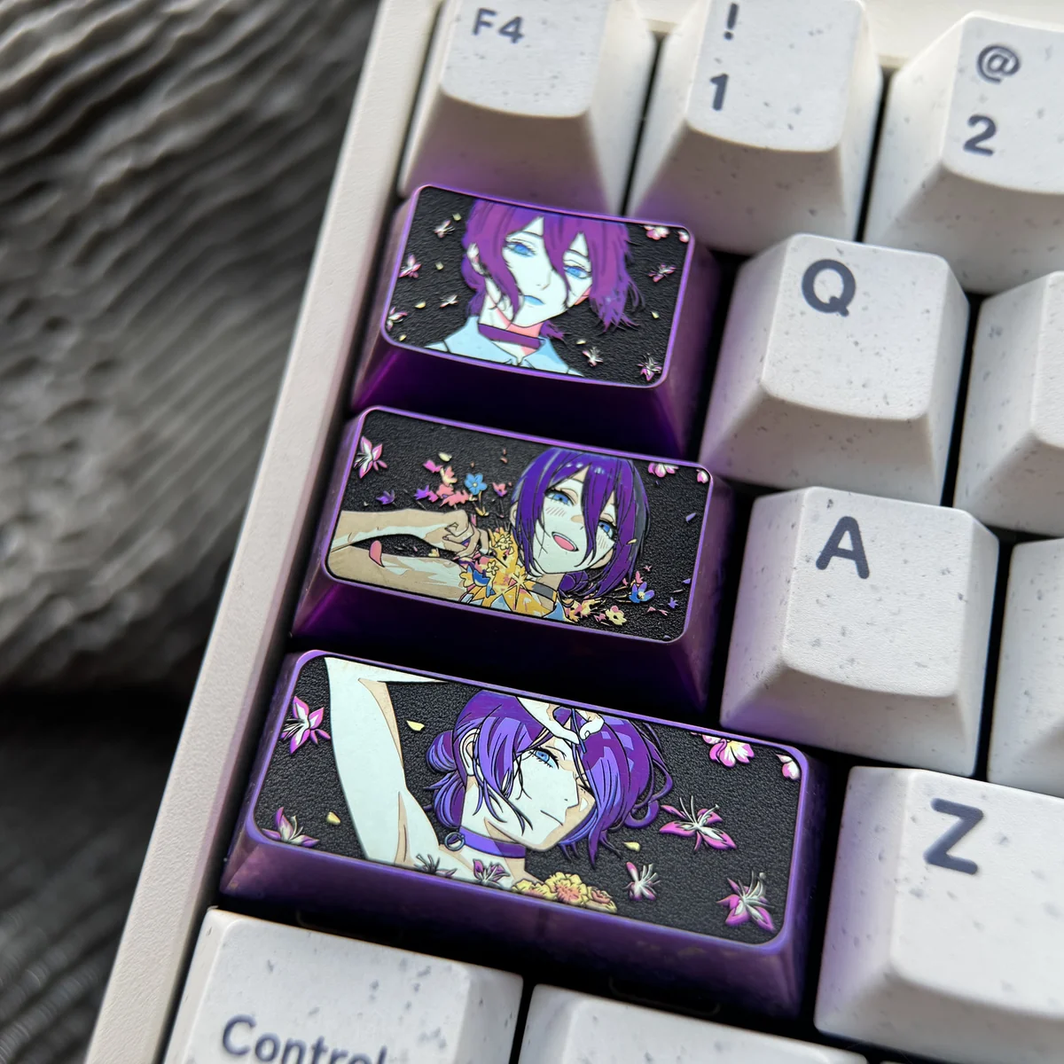 Chainsaw Man: Reze Themed Titanium Keycaps gallery showcasing its vibrant, unique abstract patterns and premium metallic finish from multiple angles. Artistry.