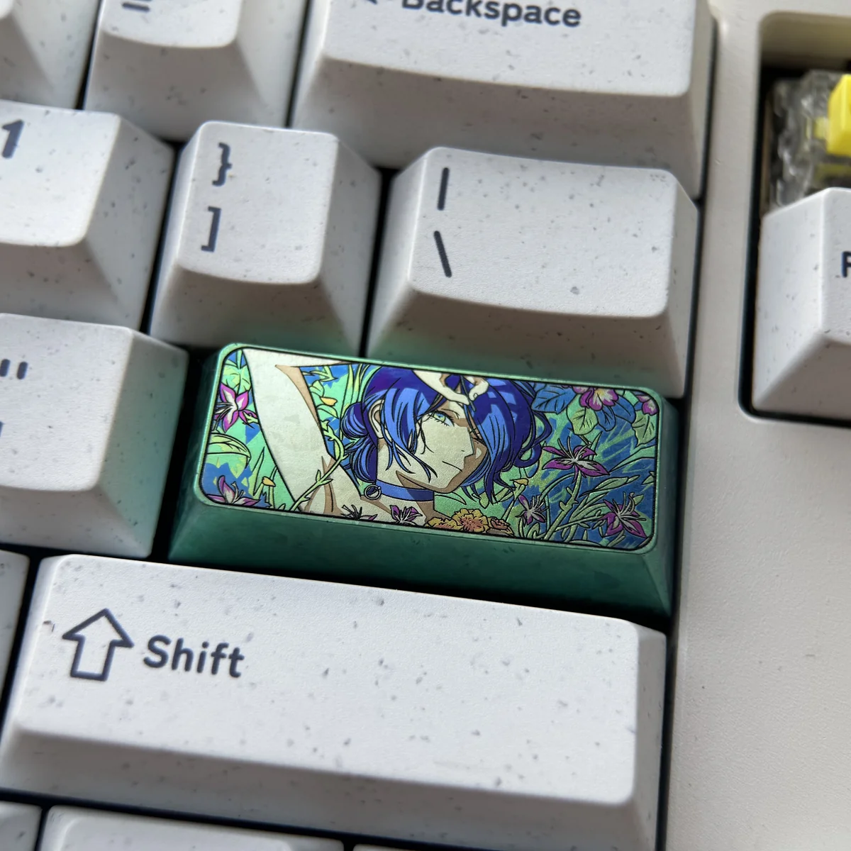 Explore a gallery of Chainsaw Man: Reze Themed Titanium Keycaps, each angle revealing vibrant abstract patterns and unique artistry on the durable metallic allure.