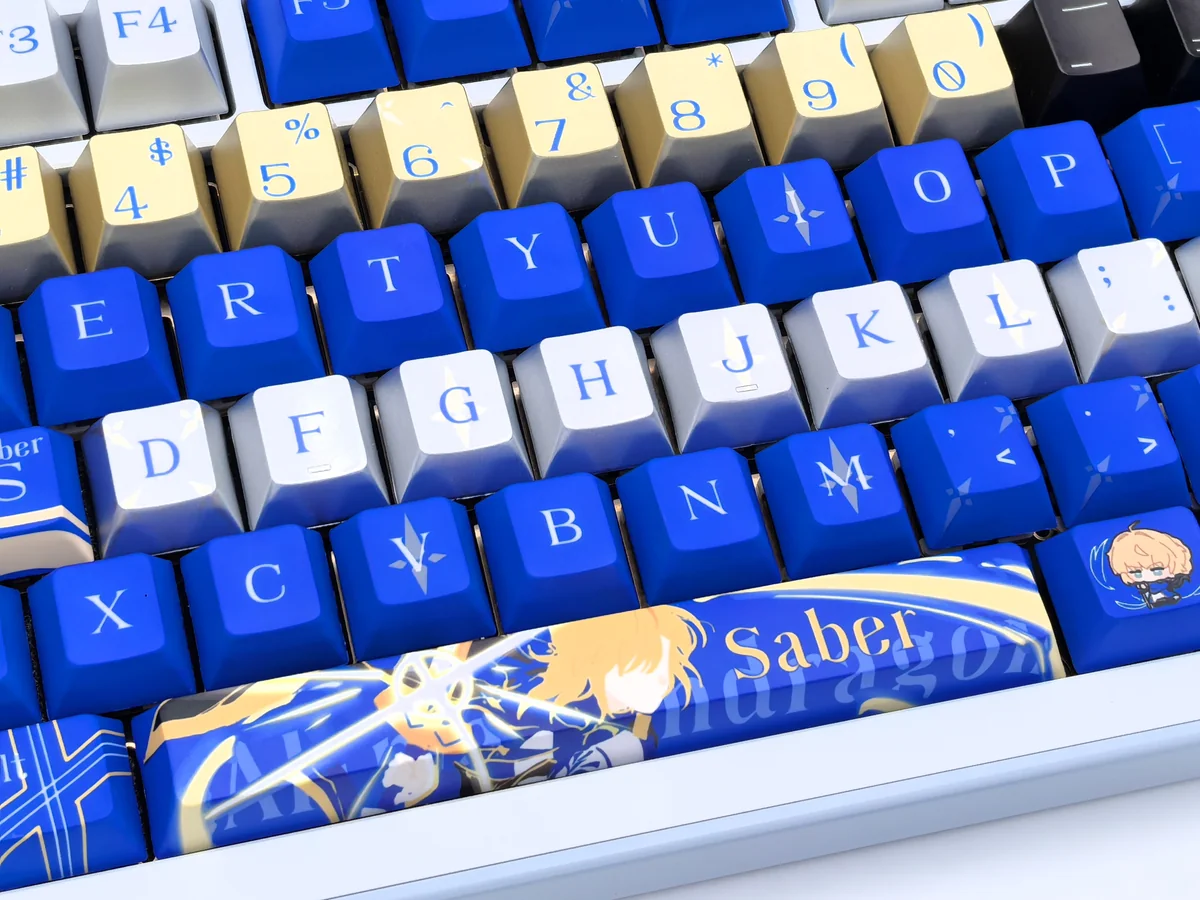 Gleaming Saber Excalibur metallic coating PBT dye-sub keycaps set, artfully displayed to highlight their intricate Saber-themed design and premium finish.