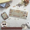 Adorable Siamese cat PBT keycaps set. Unique dye-sublimated designs of playful Siamese cats in warm, soft colors on durable PBT, shown from various angles.