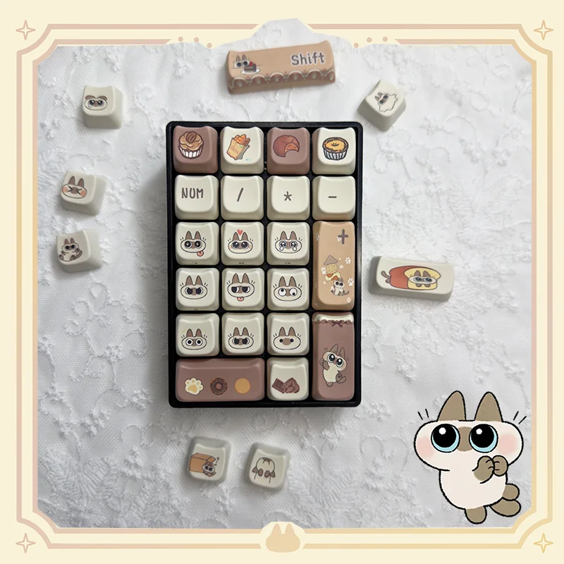 Adorable Siamese cat PBT keycaps set from multiple angles, showcasing the unique dye-sub illustrations and durable PBT material with warm, soft colors.