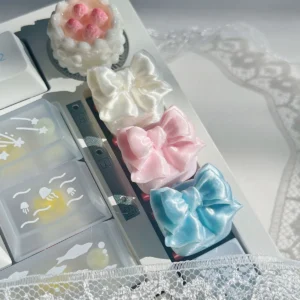 Close-up of an ethereal handcrafted silk bow butterfly artisan keycap, showcasing its delicate wings and flowing silk, perfect for whimsical keyboards.