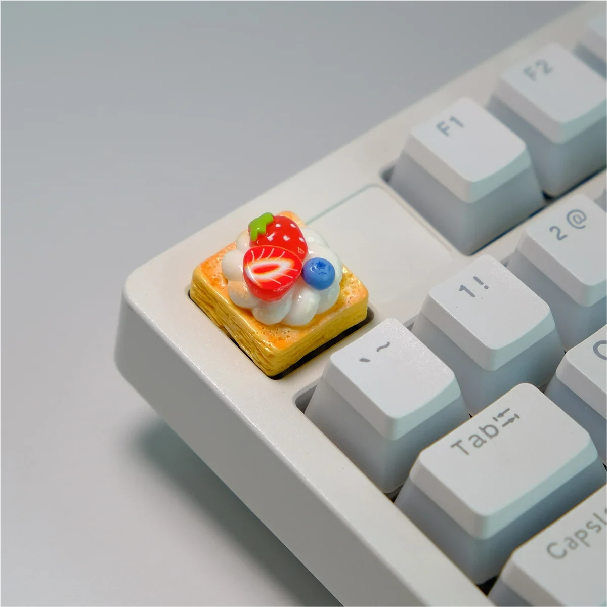 Handmade strawberry mille-feuille artisan keycap, revealing hyper-realistic vibrant pink and cream dessert layers from artistic angles.