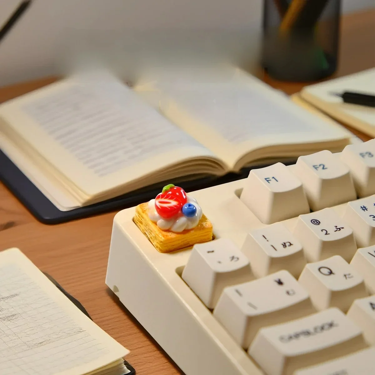 Close-up of a handmade strawberry mille-feuille artisan keycap, showcasing its hyper-realistic vibrant pink and cream layers from multiple artistic angles.