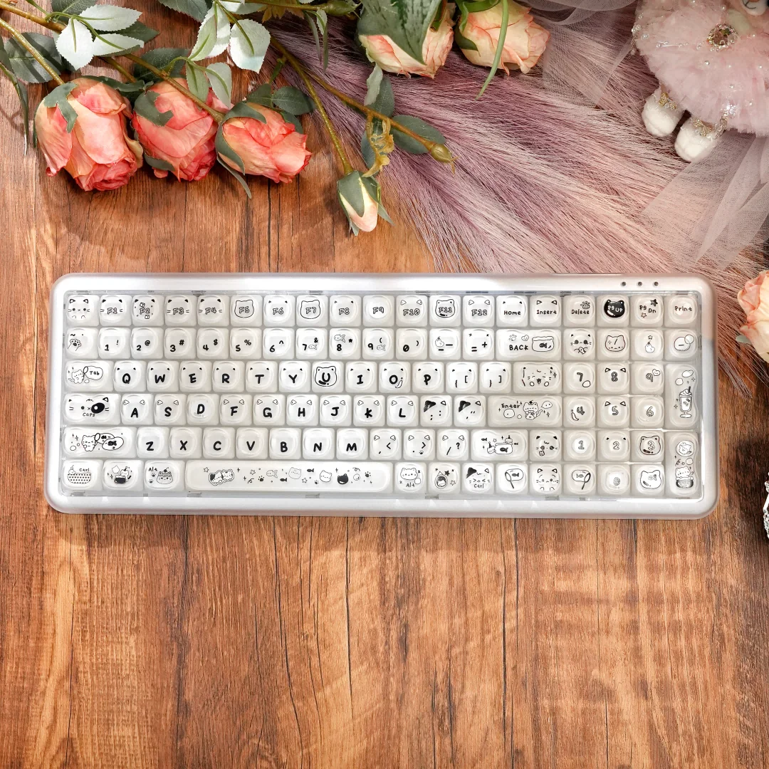Stylish X100Pro Tri-Mode Membrane Keyboard: Silent tri-mode cat charm, pastel colors, and soft RGB illumination. See its playful design details from various angles.