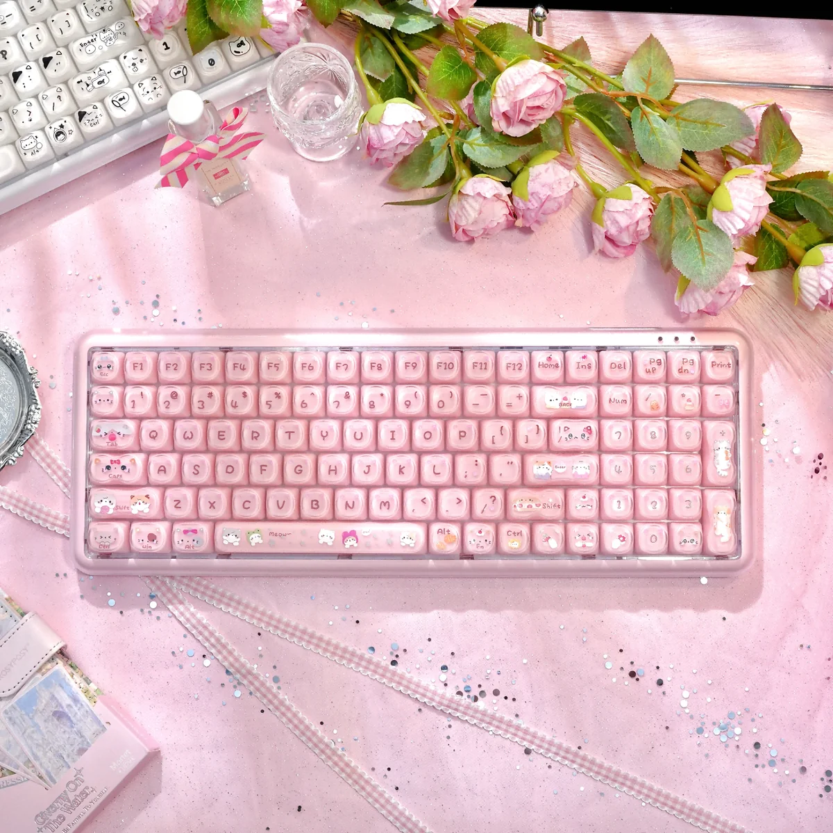 Pastel pink Stylish X100Pro Tri-Mode Membrane Keyboard featuring a cute cat charm, silent keys, and versatile tri-mode connectivity.