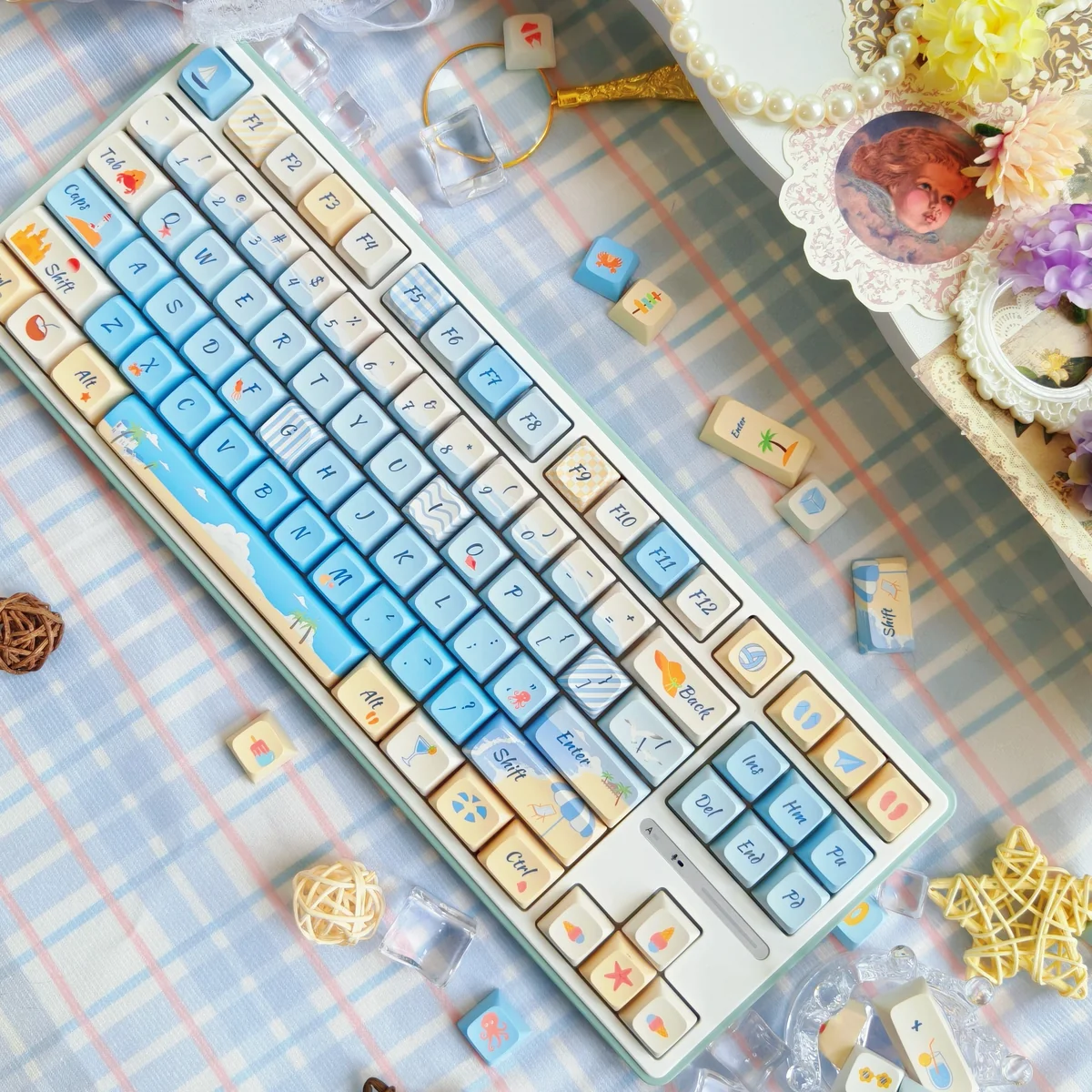 Multiple angles of serene summer beach PBT dye-sub keycaps set, showcasing vibrant ocean and sand motifs for a tranquil keyboard escape.