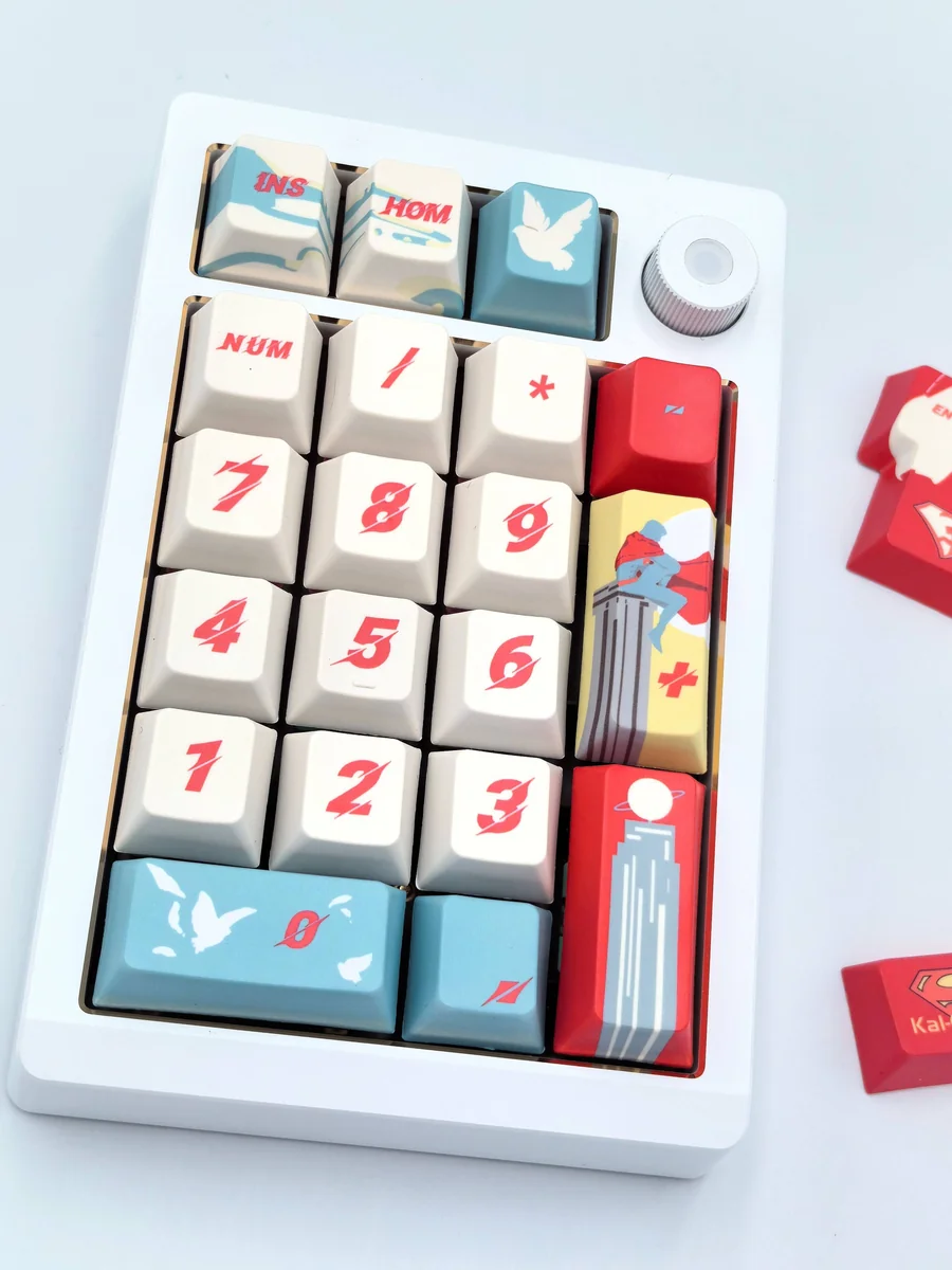 Exclusive Heroic DC Superman keycaps full set, shown from various angles. Features iconic red and blue design with classic emblem, highlighting premium character design.