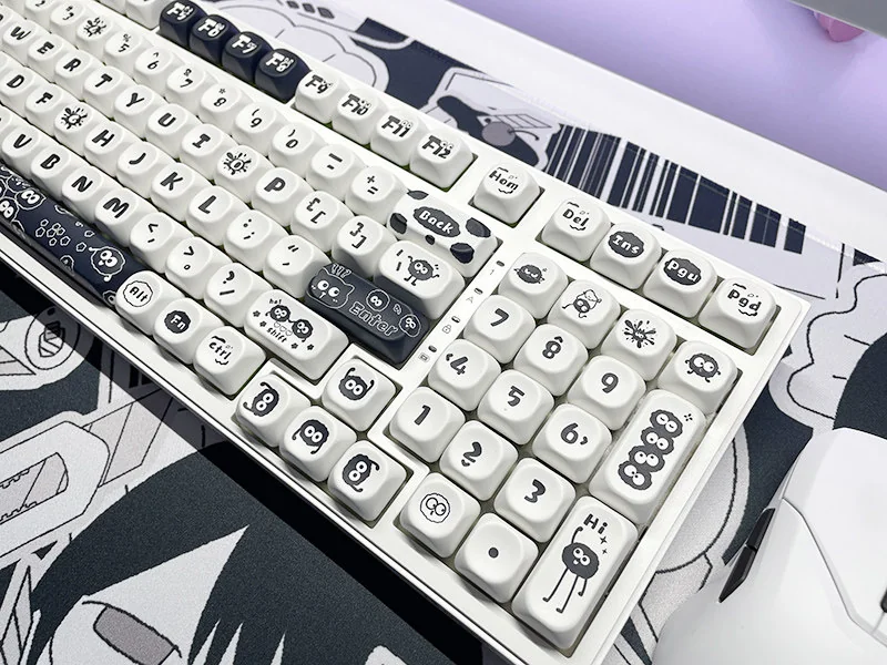 Whimsical Susuwatari PBT Dye-sub keycaps set. Enchanting dark characters on minimalist backgrounds reveal nostalgic charm from all angles.