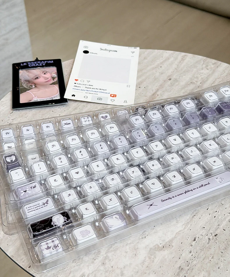 Handcrafted Ethereal Swan Realm Keycap Set, showcasing its ethereal swan design within translucent amber and deep purple layers from artistic angles.