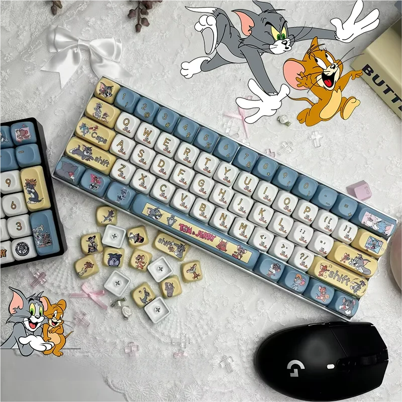 Vibrant Tom & Jerry PBT Dye-Sub keycap set, featuring iconic cartoon characters across 108 keys with a uniform MOA profile, viewed from a playful angles.