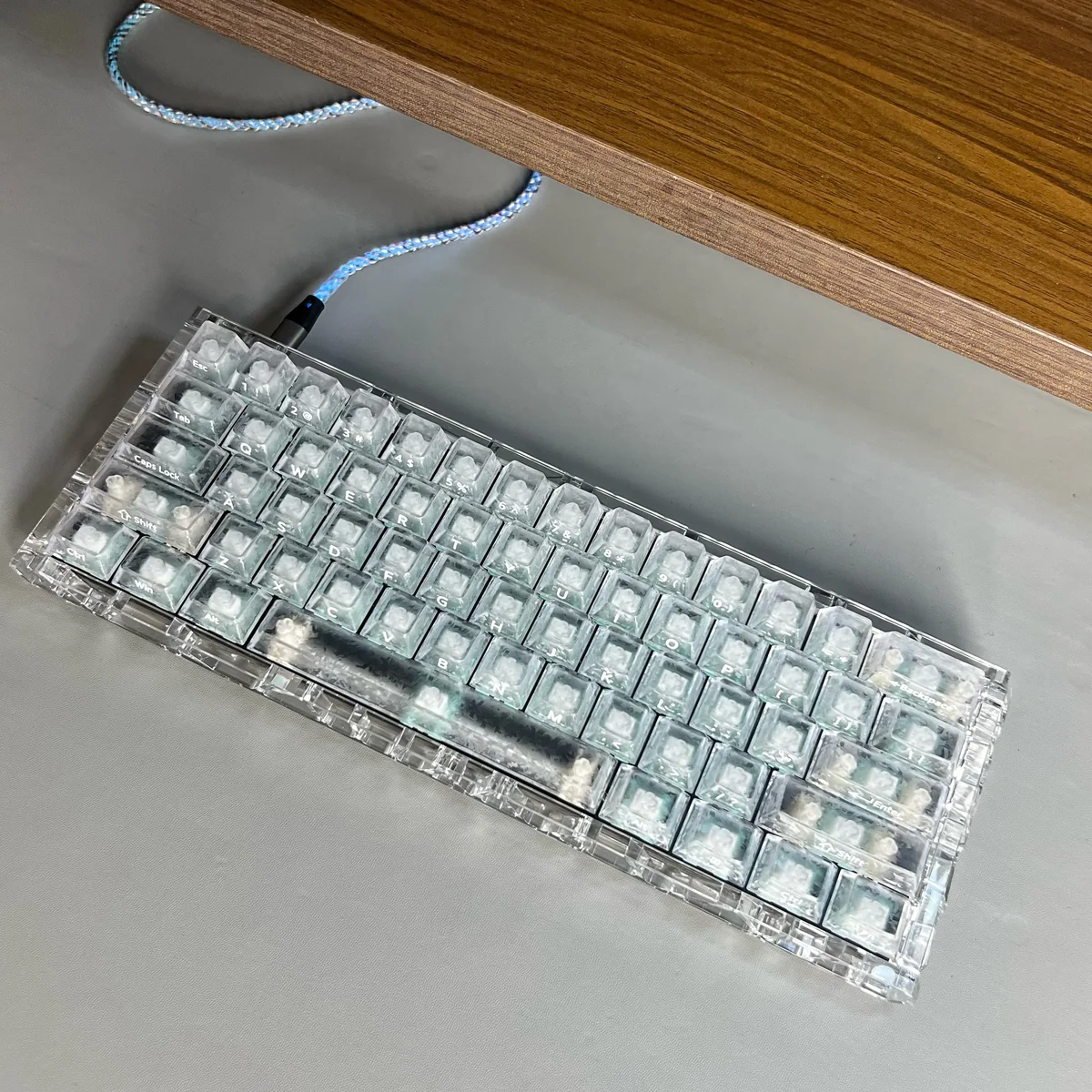 Premium forged carbon keycaps set featuring a unique ice carbon translucent texture, OEM profile, perfect for sleek side-lit gaming setups.