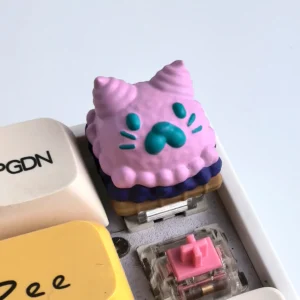 Whimsical 3D puppy keycap displayed from various angles, highlighting its unique, handcrafted sketch-style design. A charming and playful desk.