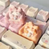 Whimsical hand-sculpted artisan lounging cat keycap from various angles, highlighting the charming miniature feline on its cozy, colorful sofa design.