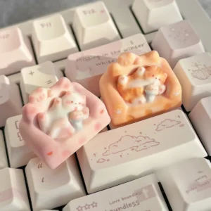 Whimsical hand-sculpted artisan cat keycap showcasing a charming miniature lounging feline on a cozy, colorful sofa design.