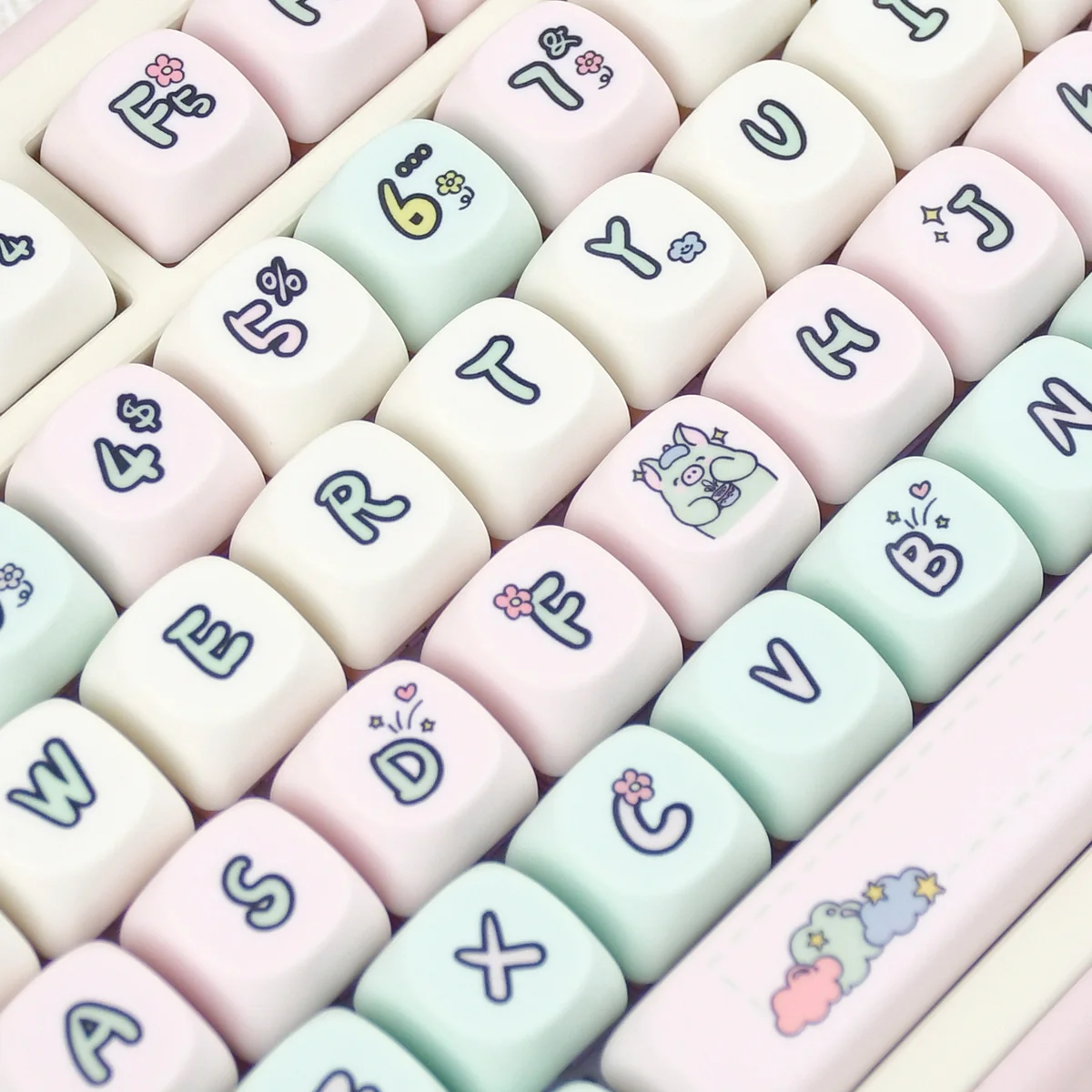 A whimsical Strawberry Pig PBT keycap set displayed from multiple angles, showcasing pastel pink, green, and white dye-sub keycaps with cute pig.