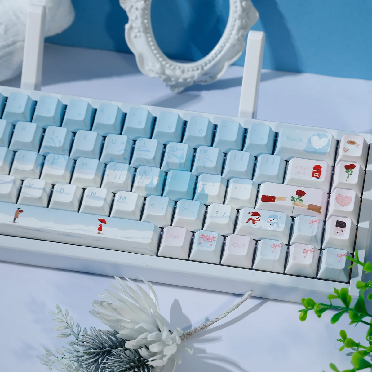 Winter Romance PBT Dye-Sub keycaps Set, shown from various angles. The premium 120-key set features soft pastel blue and pink, creating a serene, cozy winter setup.