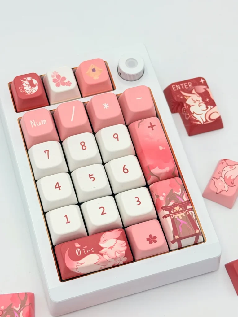 Exclusive Yae Miko Genshin Impact MDA keycap set, beautifully displayed from various angles, revealing intricate mystical fox motifs and elegant character design.