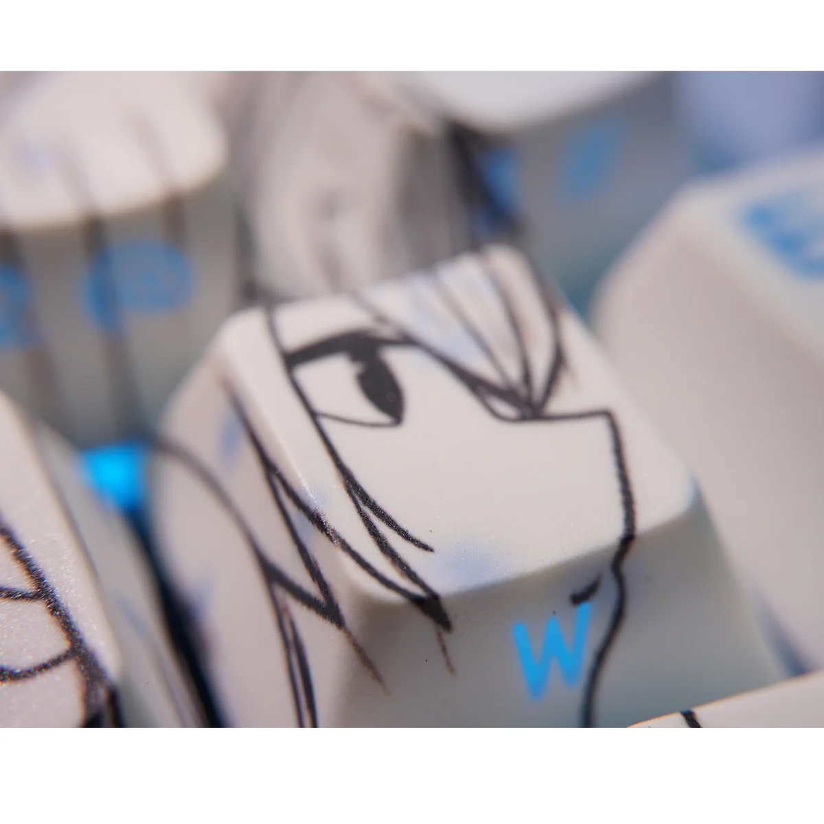 Yukino Gradient Blue Side-Lit PBT keycaps set, artistically showcased from various angles to highlight their minimalist side-engraved legends and subtle anime setup.