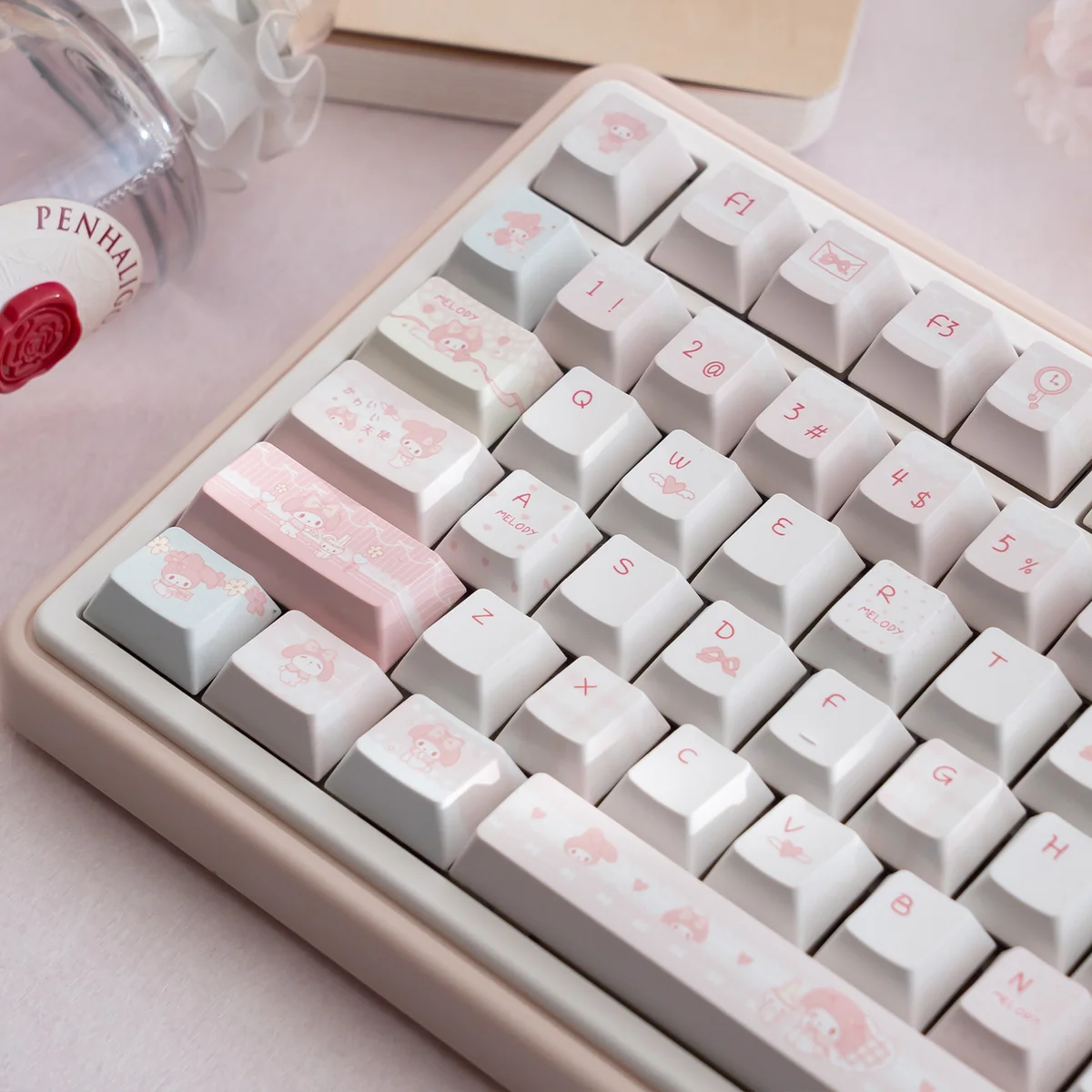 Angled view of adorable pink My Melody PBT dye-sub keycaps set, highlighting the cute Sanrio character design and whimsical charm.