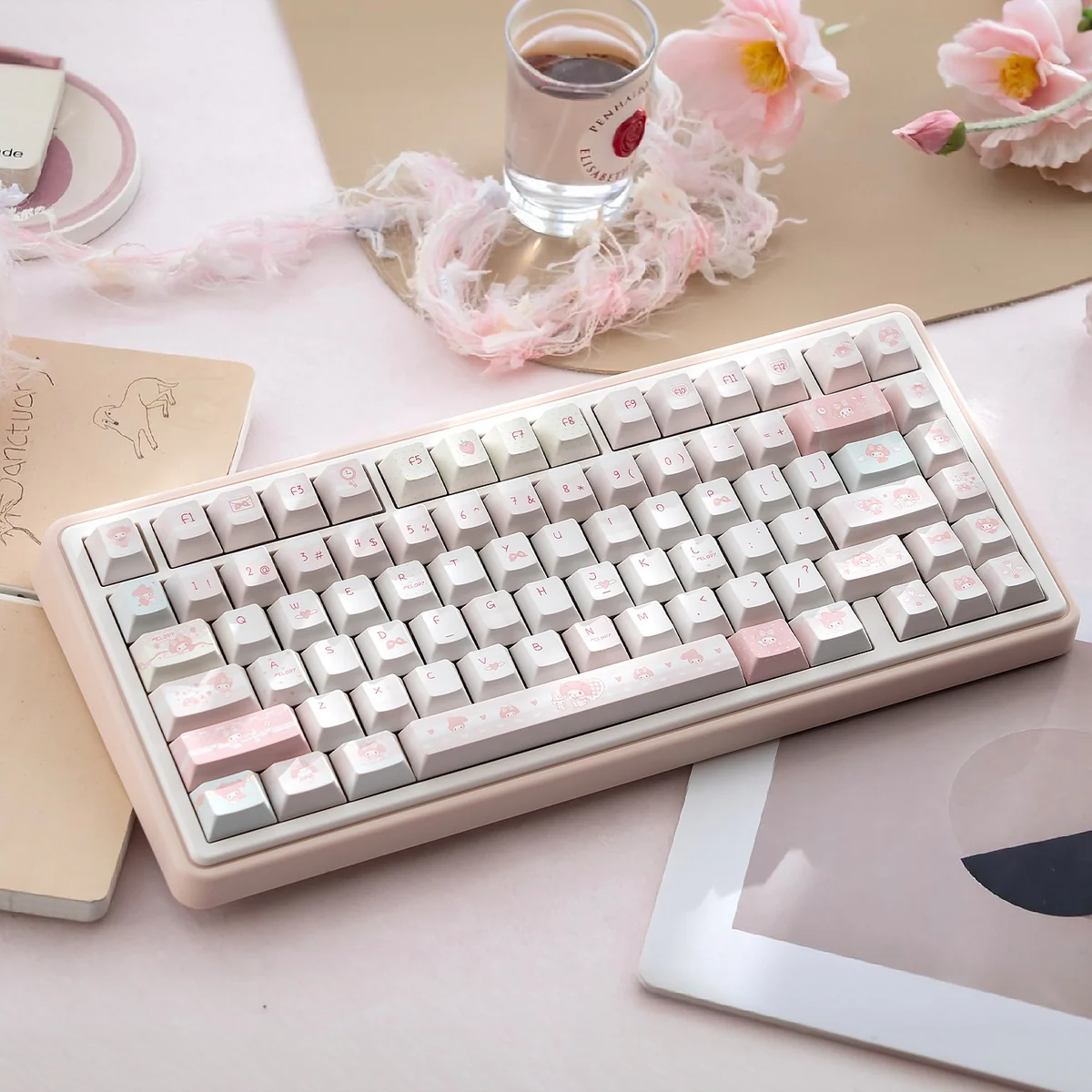 Adorable pastel pink My Melody PBT dye-sub keycaps set, showcasing their cute Sanrio character designs. This charming set offers a whimsical and playful keycaps.