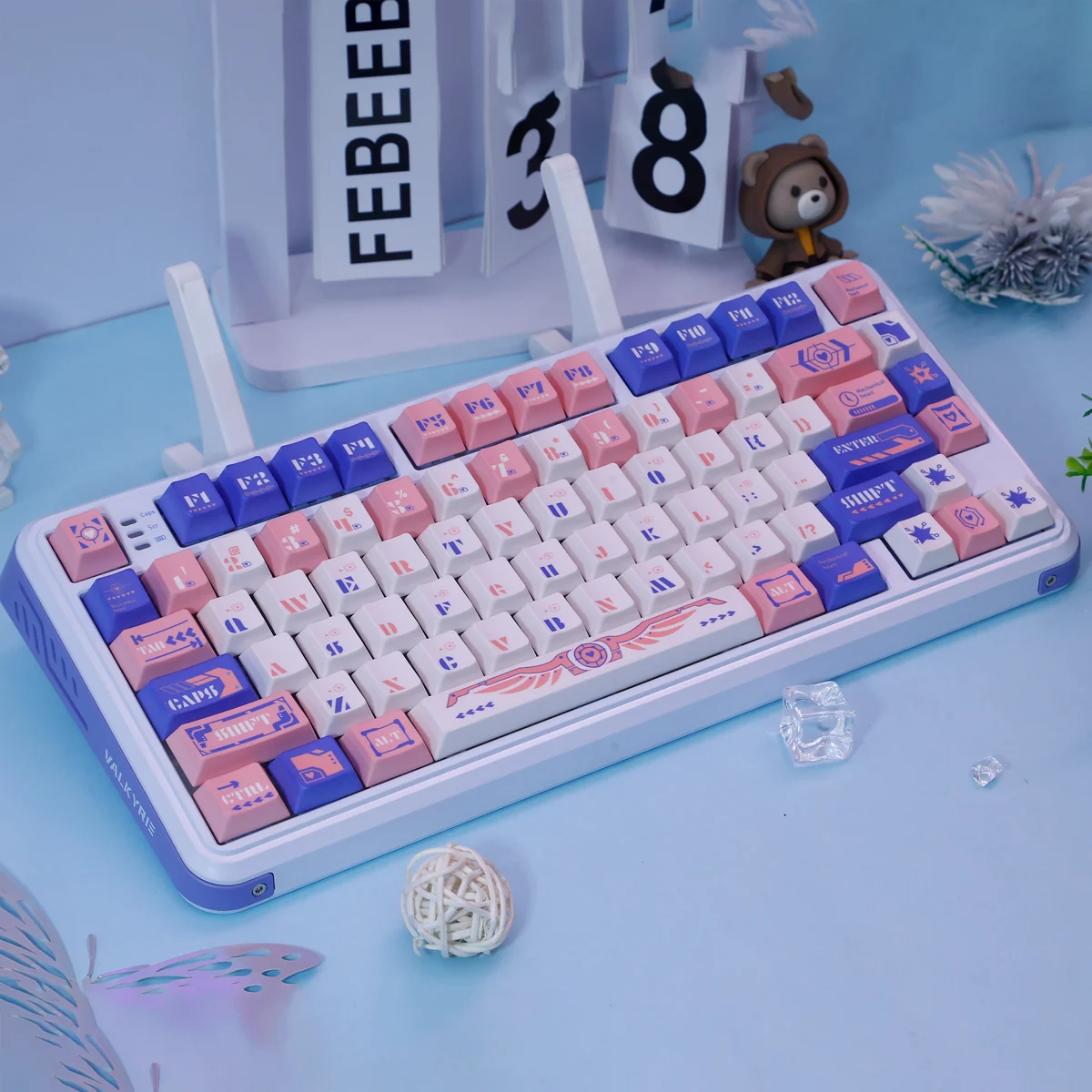 Ethereal Mechanical Angel Keycap set in soft blue and pink dye-sub PBT, showcasing intricate celestial wing designs from a unique angle, highlighting premium artistic.