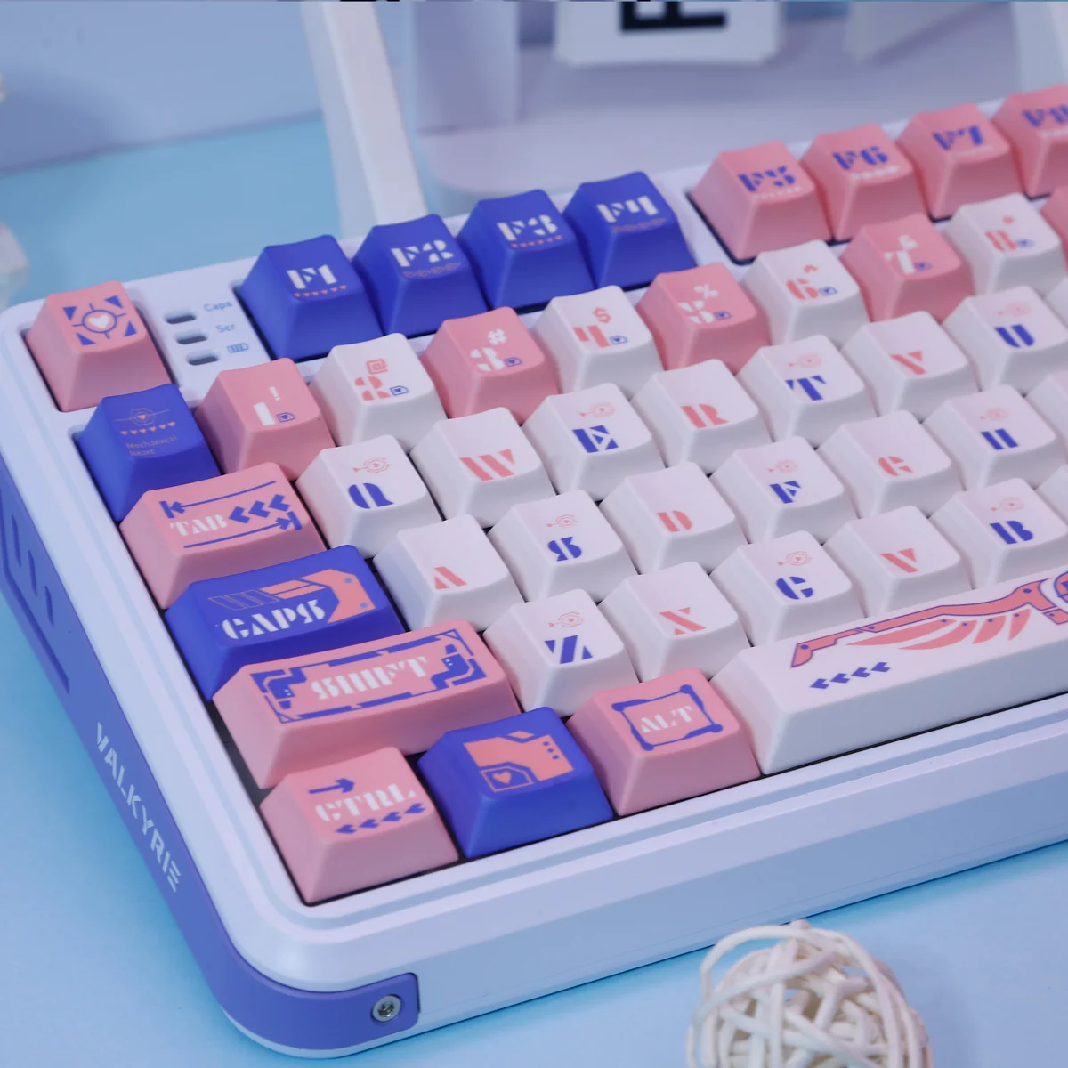Close-up view of Mechanical Angel Keycap Set, highlighting the ethereal blue and pink PBT legends and intricate celestial artwork from various perspectives.