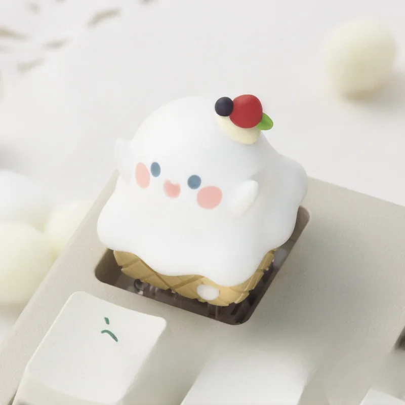 Close-up of a whimsical ghost ice cream cone artisan keycap, highlighting its spooky-cute, intricately layered resin craftsmanship from a unique perspective.