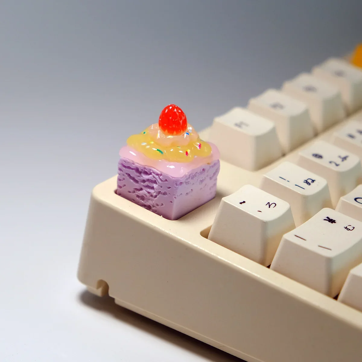 Multiple angles of the handcrafted, delectable strawberry cream artisan keycap, showcasing its vibrant, whimsical dessert layers.