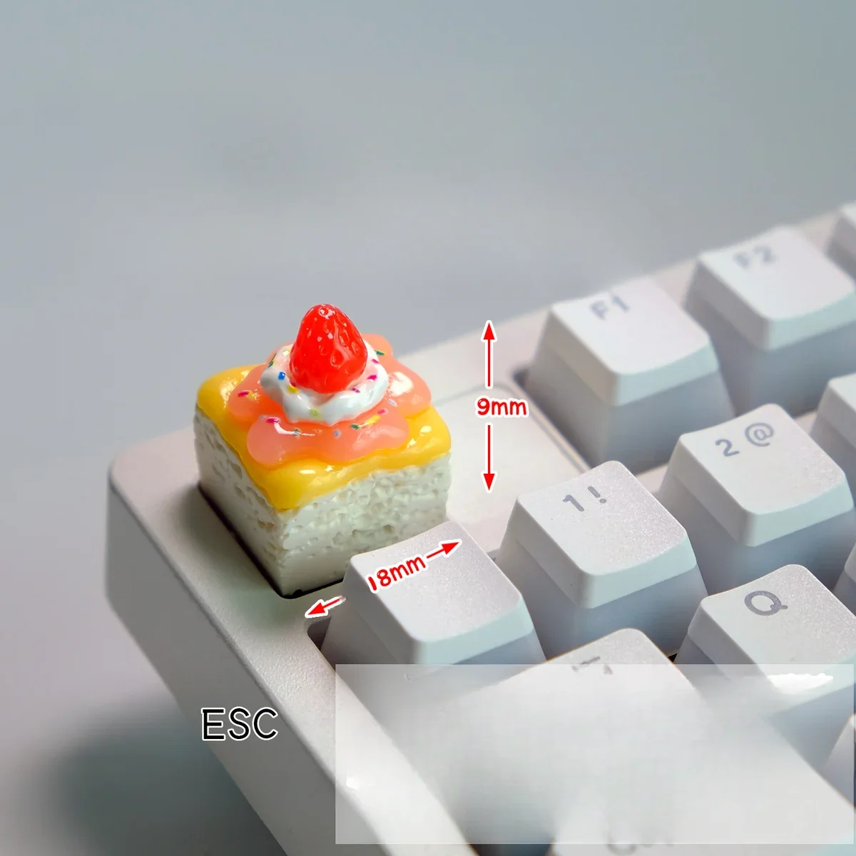 Multiple angles of a handcrafted delectable strawberry cream artisan keycap, showcasing its vibrant layers and whimsical dessert fantasy design.
