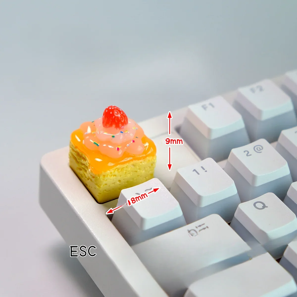 Handcrafted artisan keycap featuring a whimsical cheesecake design with creamy textures, part of a delectable dessert fantasy collection.