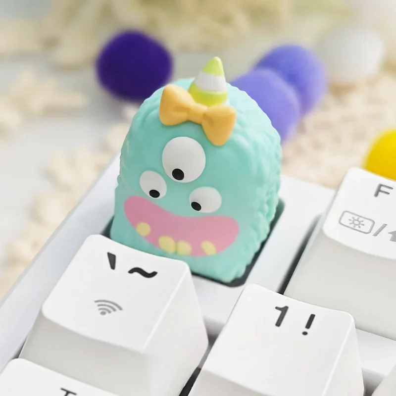 Unique handcrafted whimsical monster ESC artisan resin keycap, featuring vibrant layered translucent resin from multiple angles.