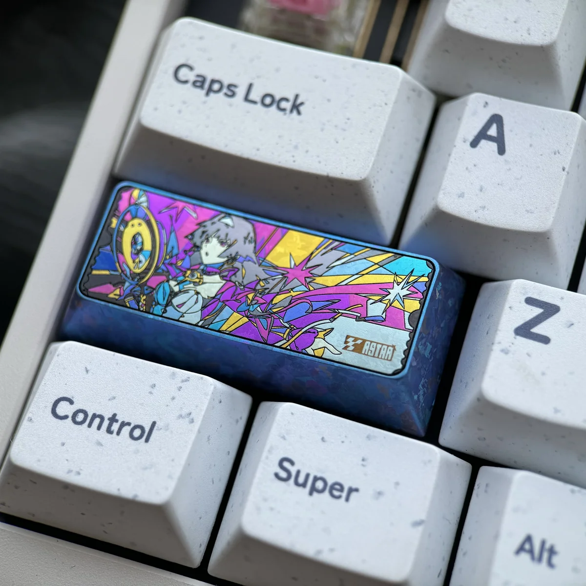 Close-up gallery of Astra Yao iridescent titanium keycap, highlighting handcrafted cosmic patterns and shimmering celestial artistry from multiple angles.