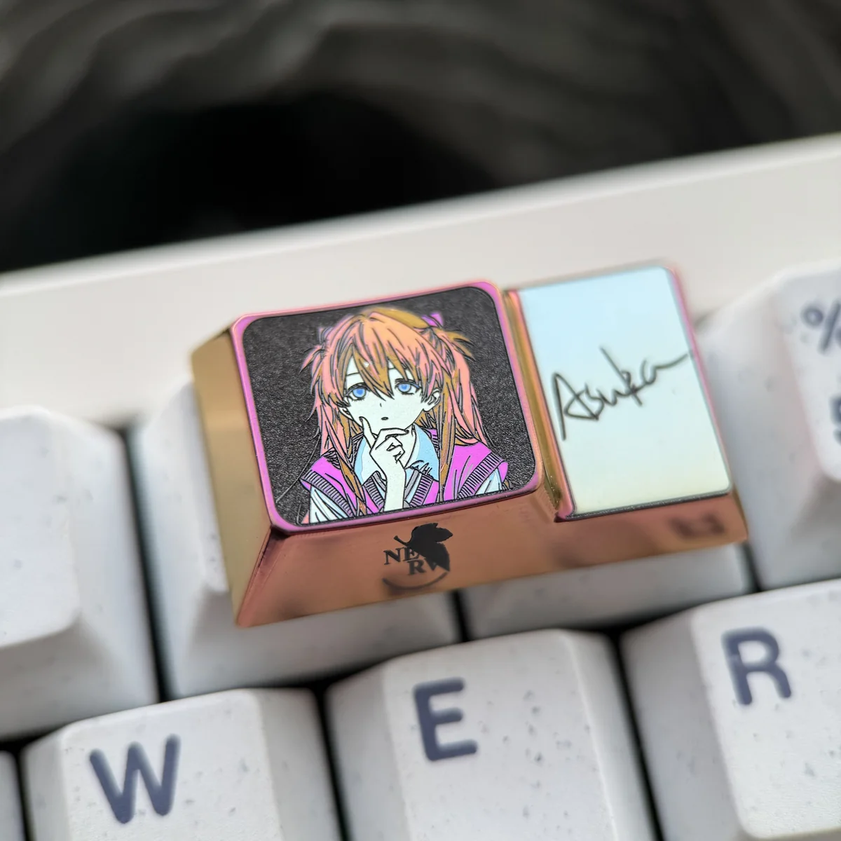 Collection display of unique Asuka Evangelion titanium keycap, emphasizing its detailed craftsmanship and collector appeal.