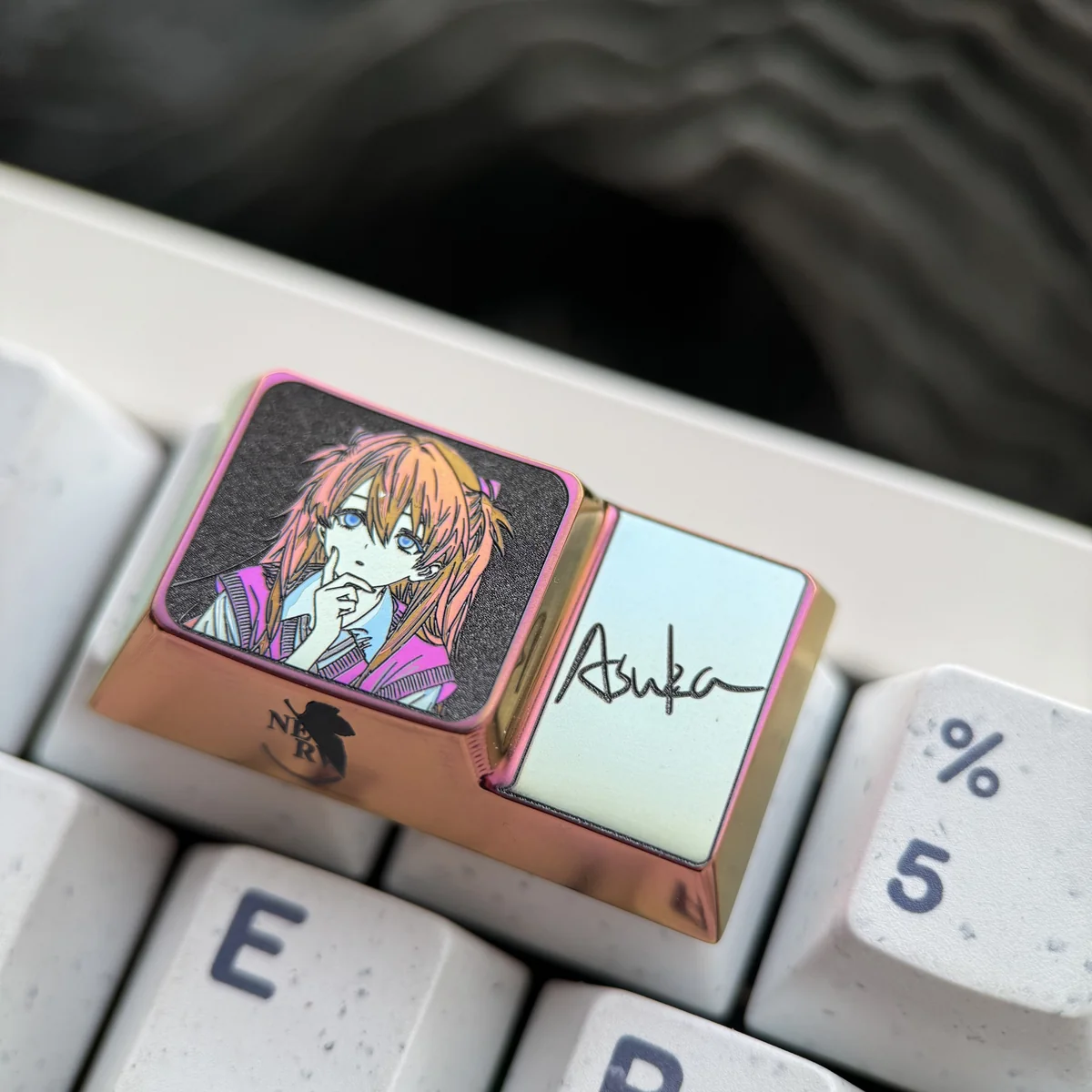 Futuristic Asuka anime keycap, a polished titanium accessory designed for custom mechanical keyboard setups.