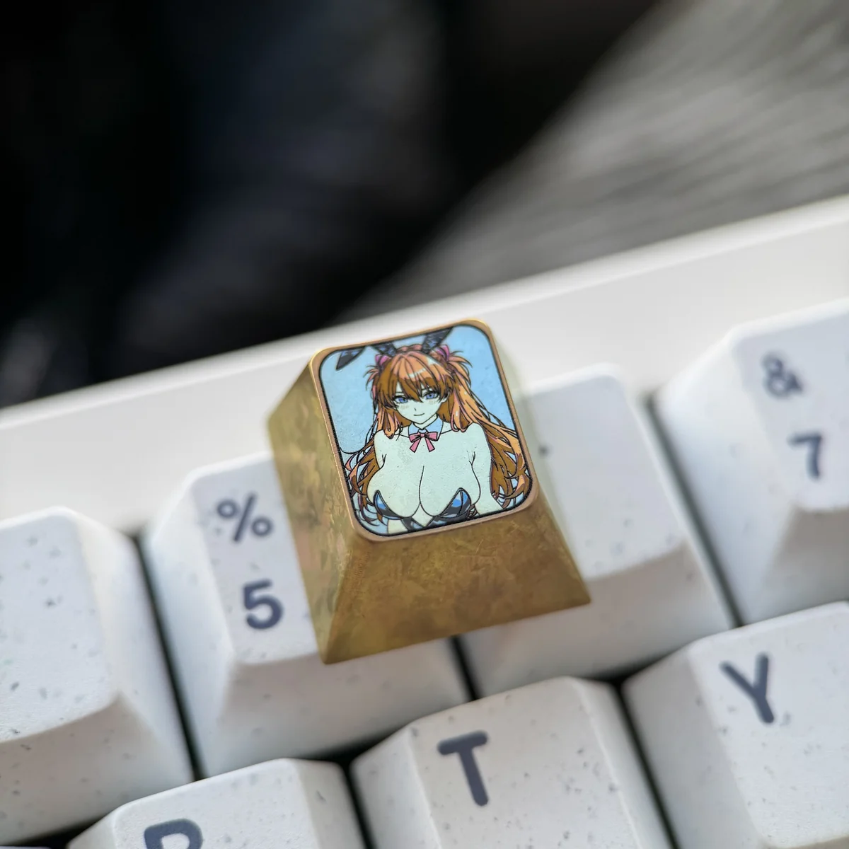 Detailed gallery views of the premium titanium Asuka Bunny Girl artisan keycap, highlighting its vibrant anime art and metallic finish.