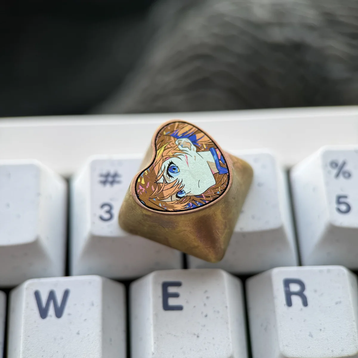 Detailed product photography of the Asuka character titanium keycap, highlighting its craftsmanship.