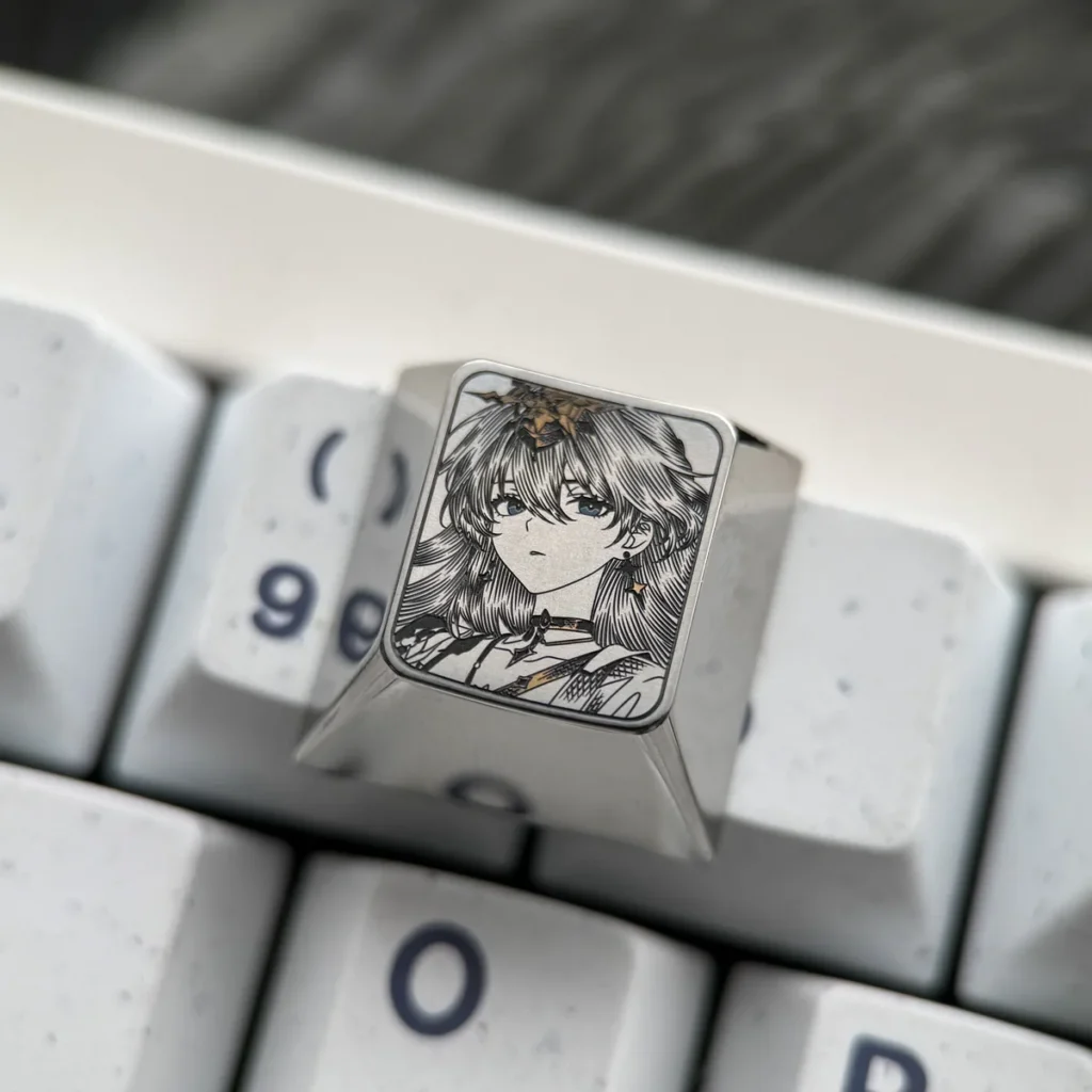 Exquisite Wuthering Waves Titanium Artisan Keycap showcasing intricate game character art with vibrant enamel-like coloring on polished metallic.