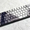 Artistic Bamboo Rain side-lit PBT keycaps set feature a unique serene bamboo rain design with a character, subtly illuminated.