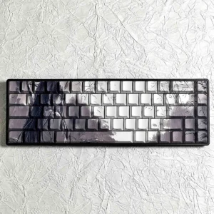 Artistic Bamboo Rain PBT Keycaps Set, showing their unique side-lit design. Serene bamboo, falling rain, and original character subtly illuminated.