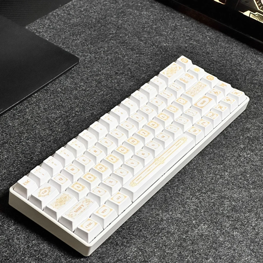 Detailed views of the Baroque PBT Dye-Sub Keycap Set, showcasing intricate platinum and neutral patterns. Highlighting exquisite artistry and PBT durability.