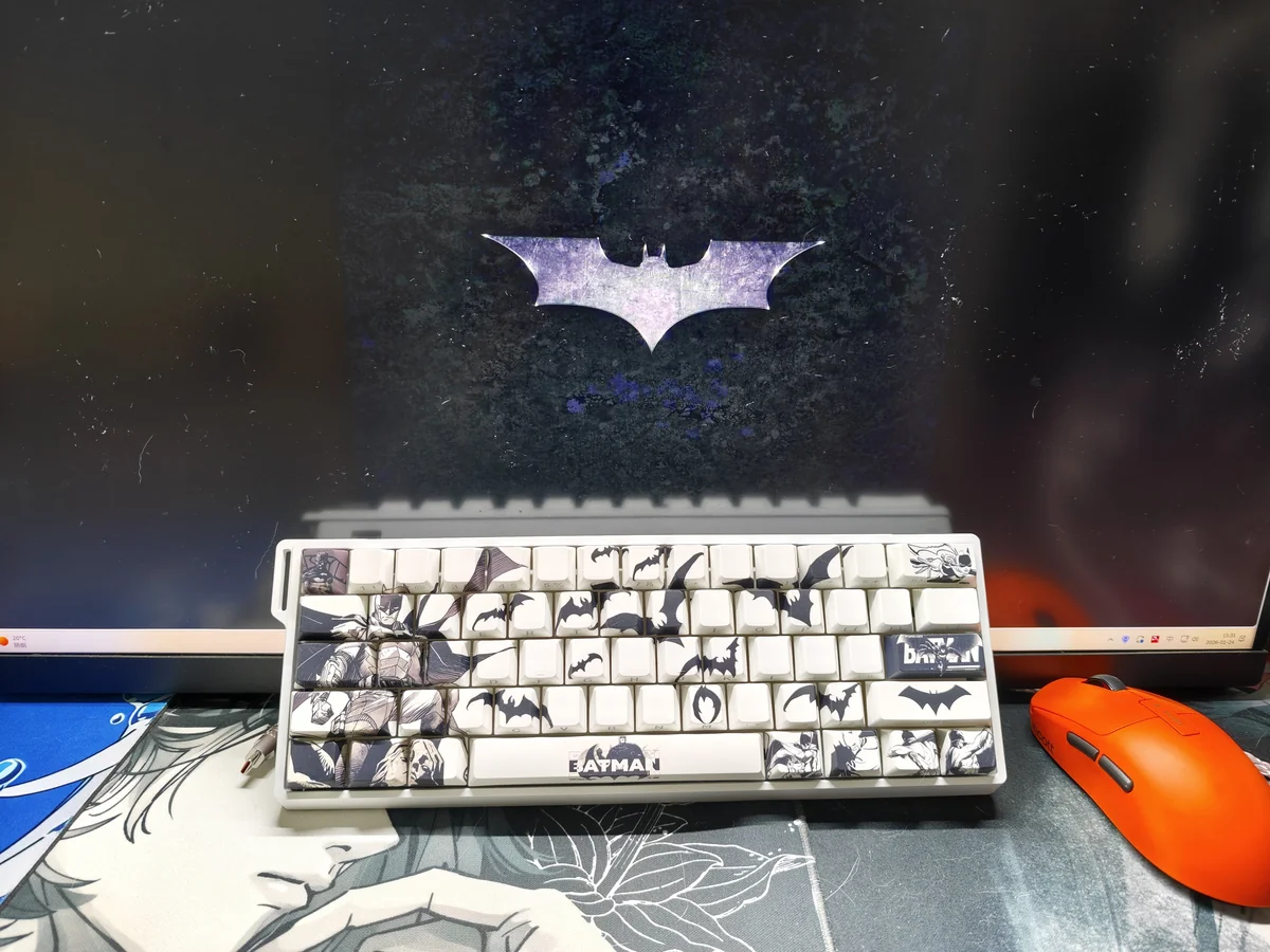 Dark PBT Batman keycaps set, expertly side-engraved with iconic symbols, shine through subtly from multiple perspectives, embodying Gotham's mysterious art.