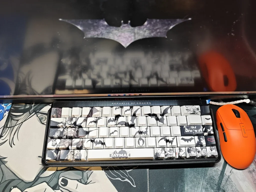 Iconic Batman PBT keycaps set featuring subtle, illuminated side-engraved legends, showcasing their shine-through effect against a dark, mysterious Gotham design.