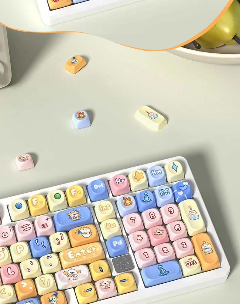 Close-up of the vibrant Birthday Party PBT Dye-Sub Keycaps Set, showcasing the playful pastel designs of balloons, cakes, and confetti from a different angles.