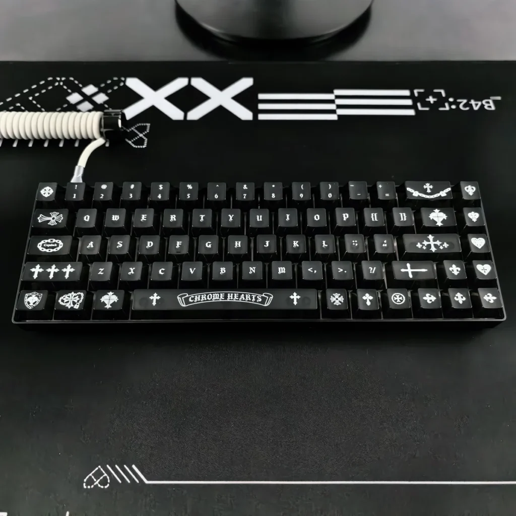 Edgy Gothic Chrome Hearts frosted PC keycap set with subtle RGB glow, showcasing its premium dark elegance.